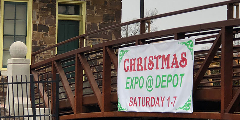 christmas expo banner posted on the side of a bridge